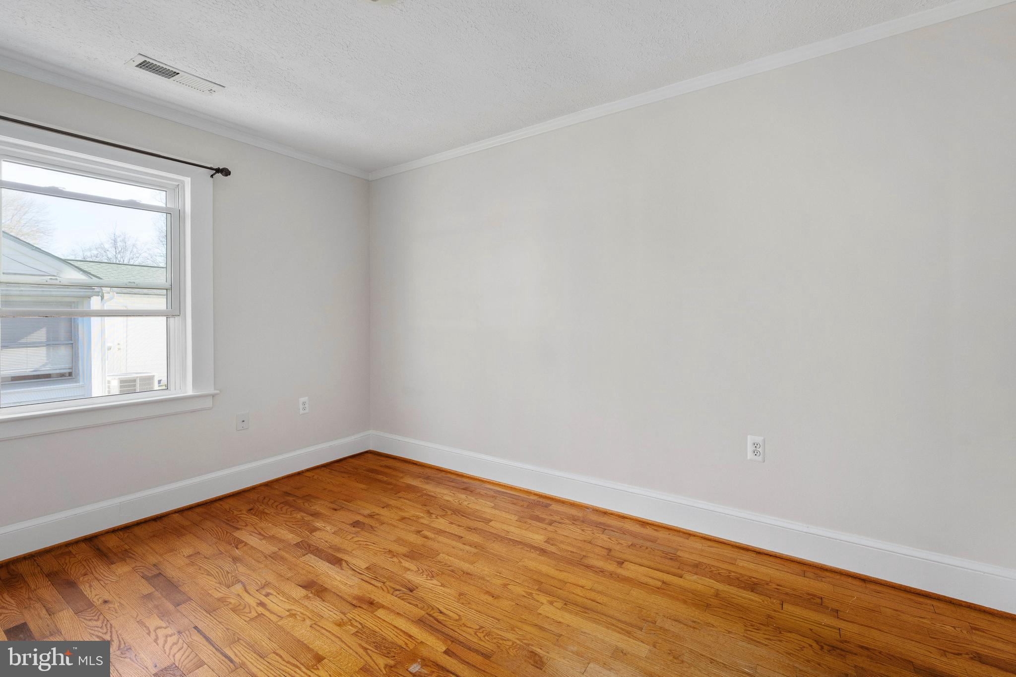 246 Berry Street Orange, VA 22960 - Photo 19 of 46 a view of empty room with wooden floor and fan