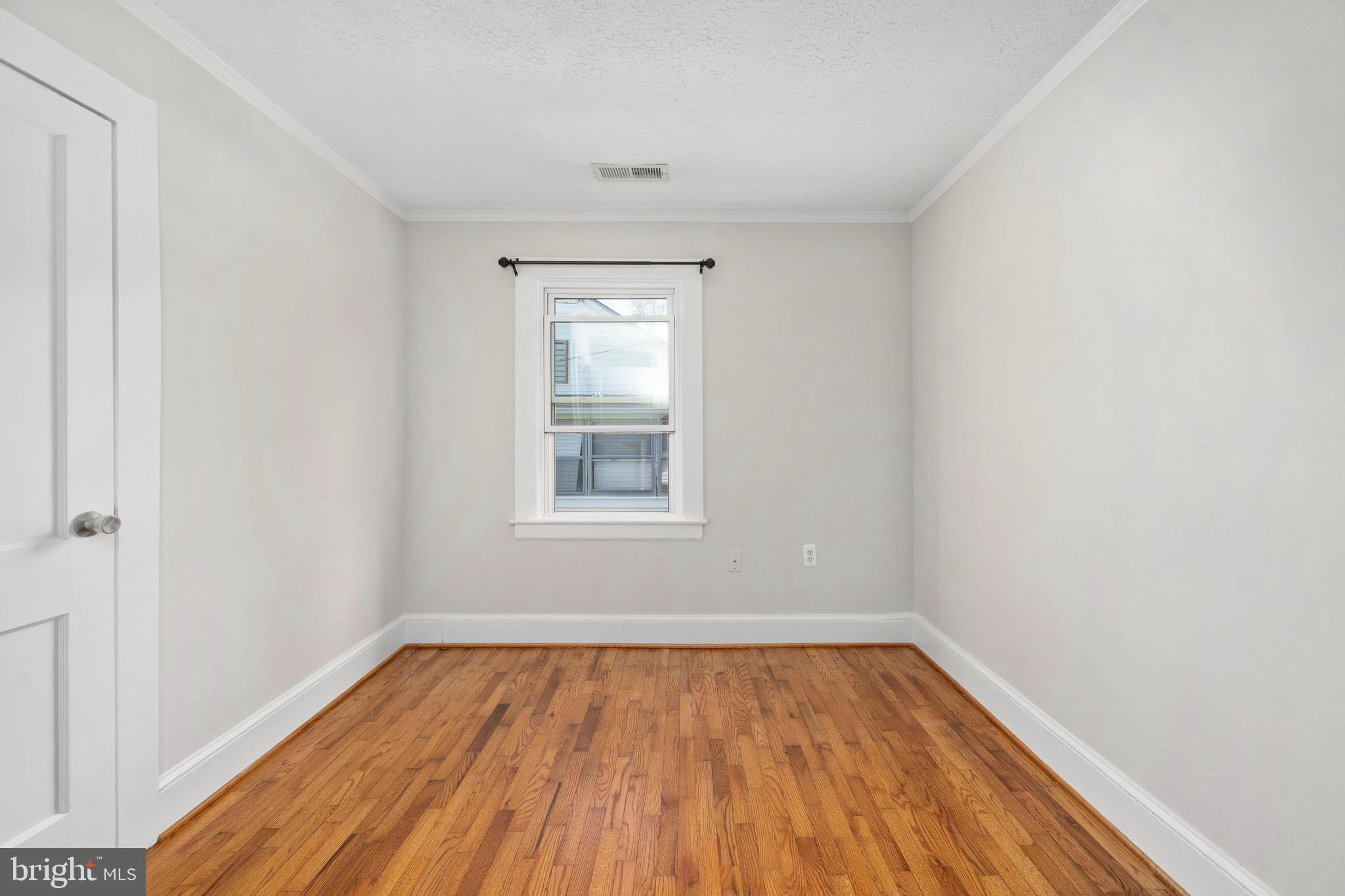 246 Berry Street Orange, VA 22960 - Photo 20 of 46 an empty room with wooden floor and windows