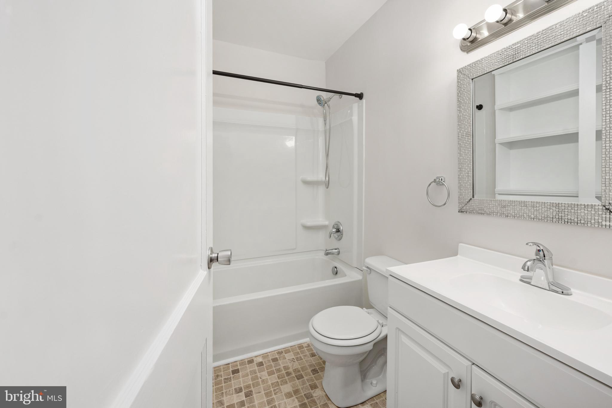 246 Berry Street Orange, VA 22960 - Photo 23 of 46 a bathroom with a sink a toilet and shower