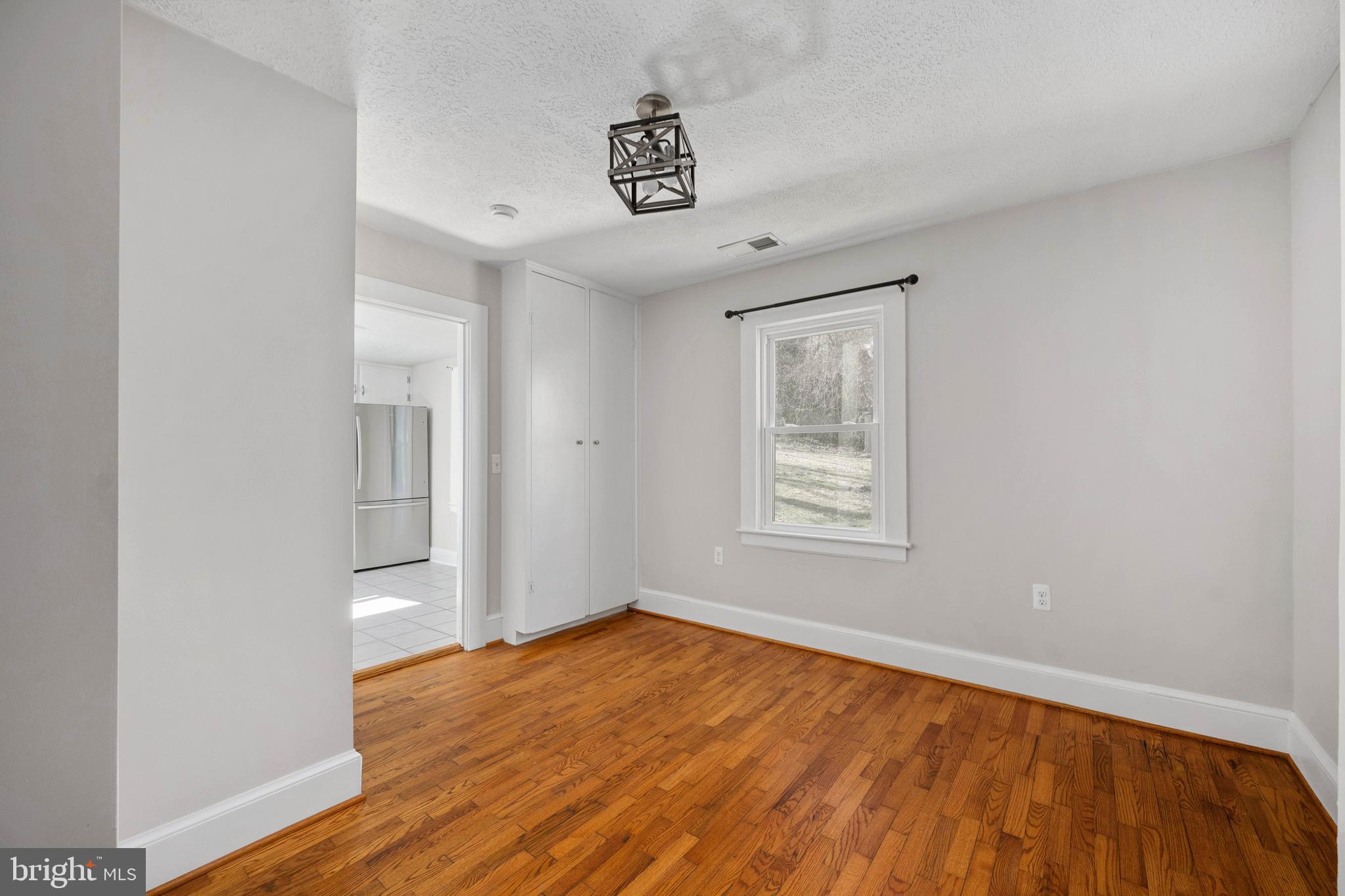 246 Berry Street Orange, VA 22960 - Photo 25 of 46 an empty room with wooden floor and windows