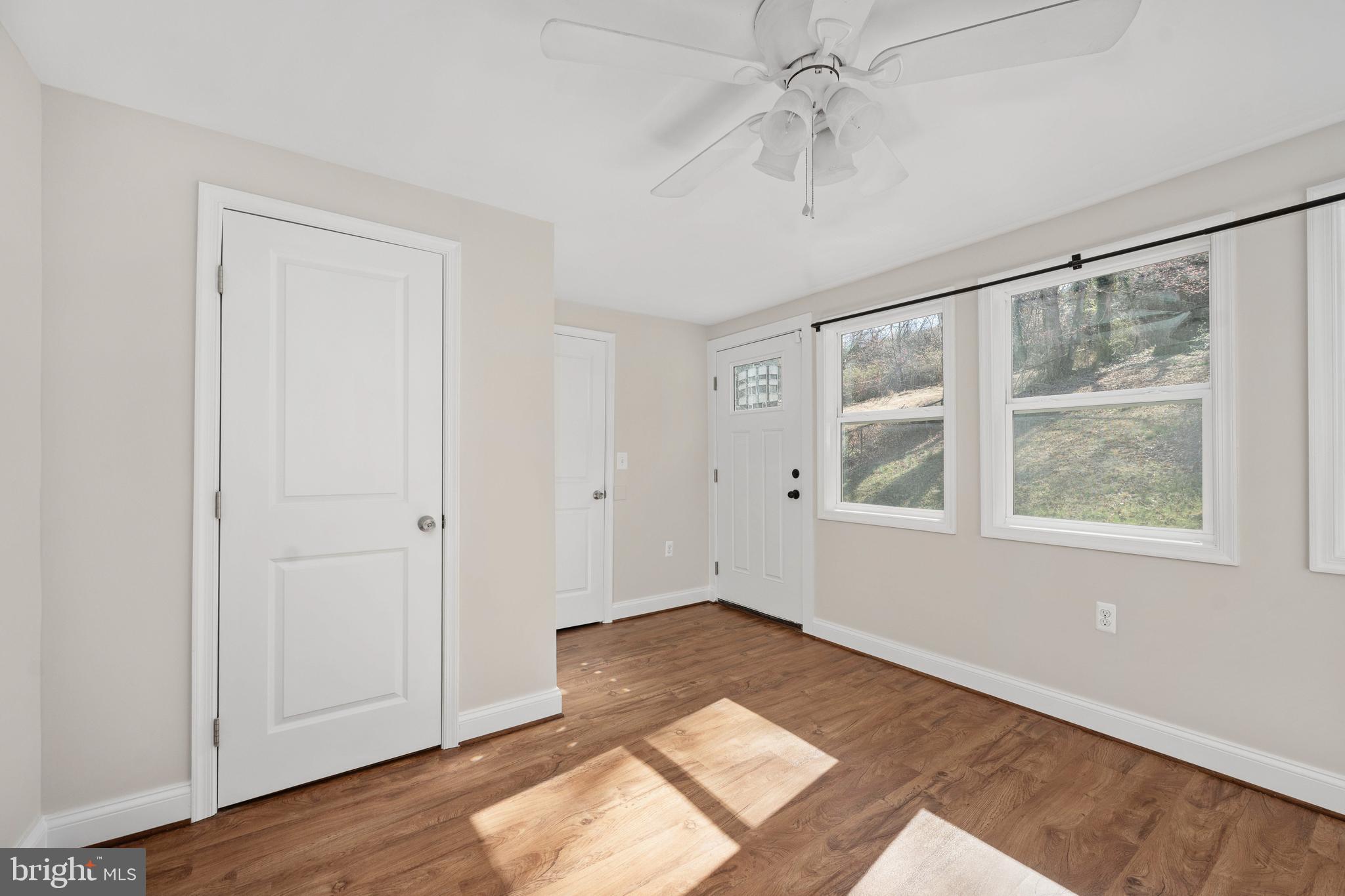 246 Berry Street Orange, VA 22960 - Photo 34 of 46 a view of an empty room with wooden floor and a window