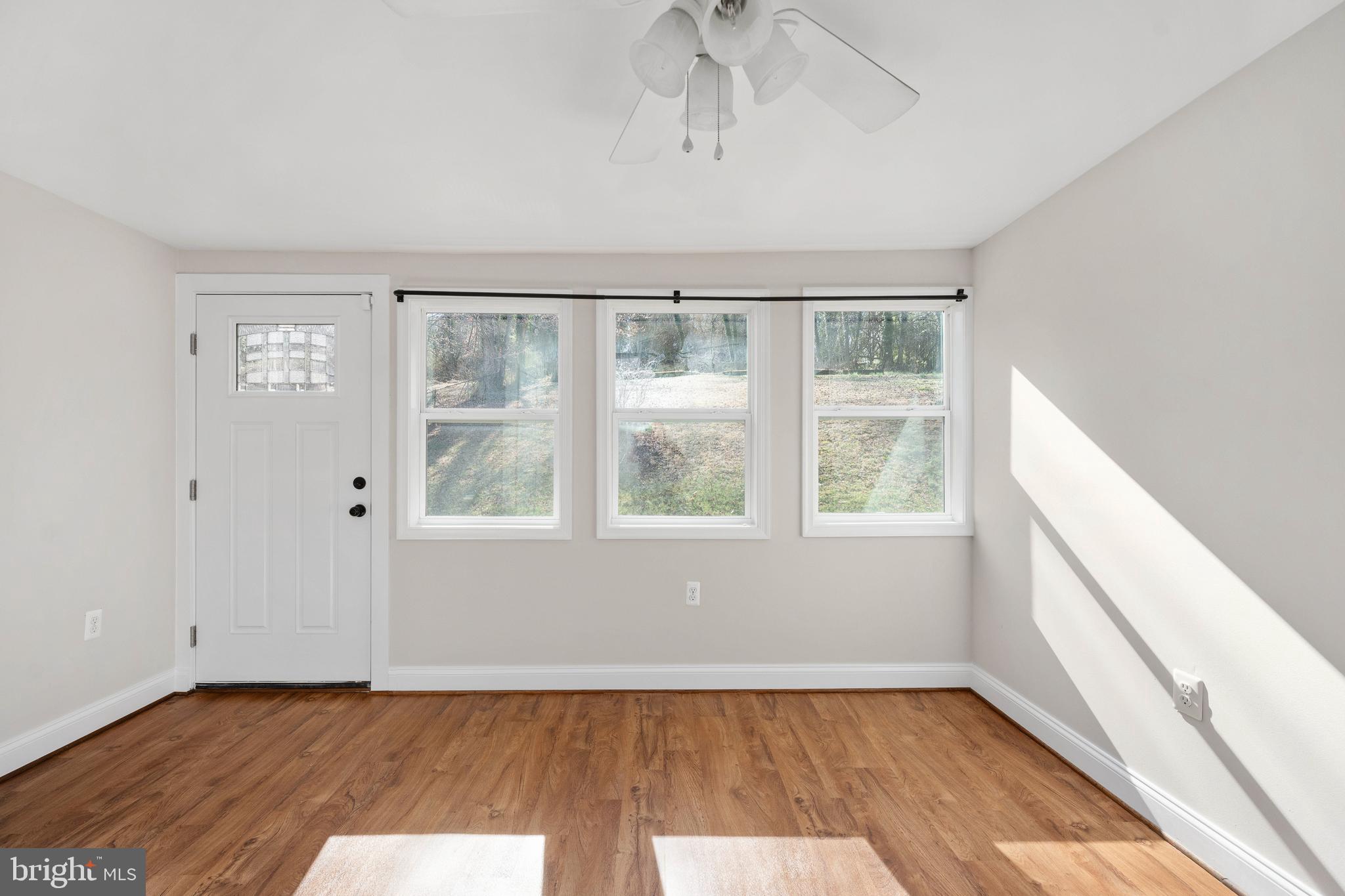 246 Berry Street Orange, VA 22960 - Photo 35 of 46 a view of an empty room with wooden floor and a window