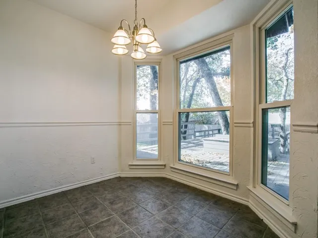 a view of a window in an empty room with a window
