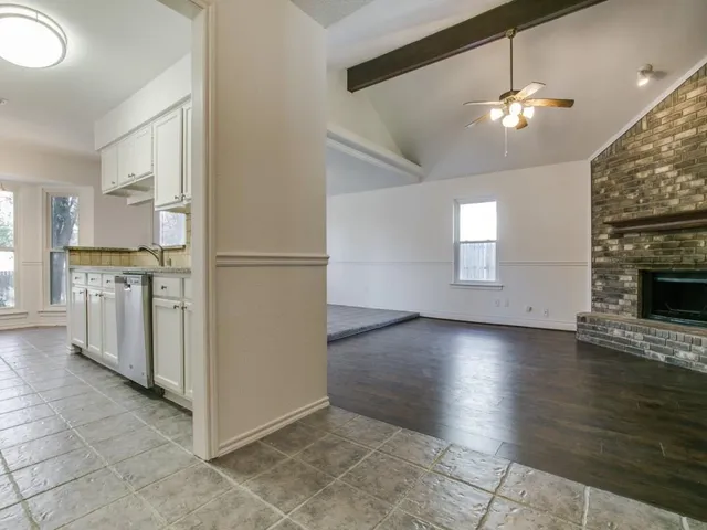 a view of a kitchen with an empty space and a kitchen