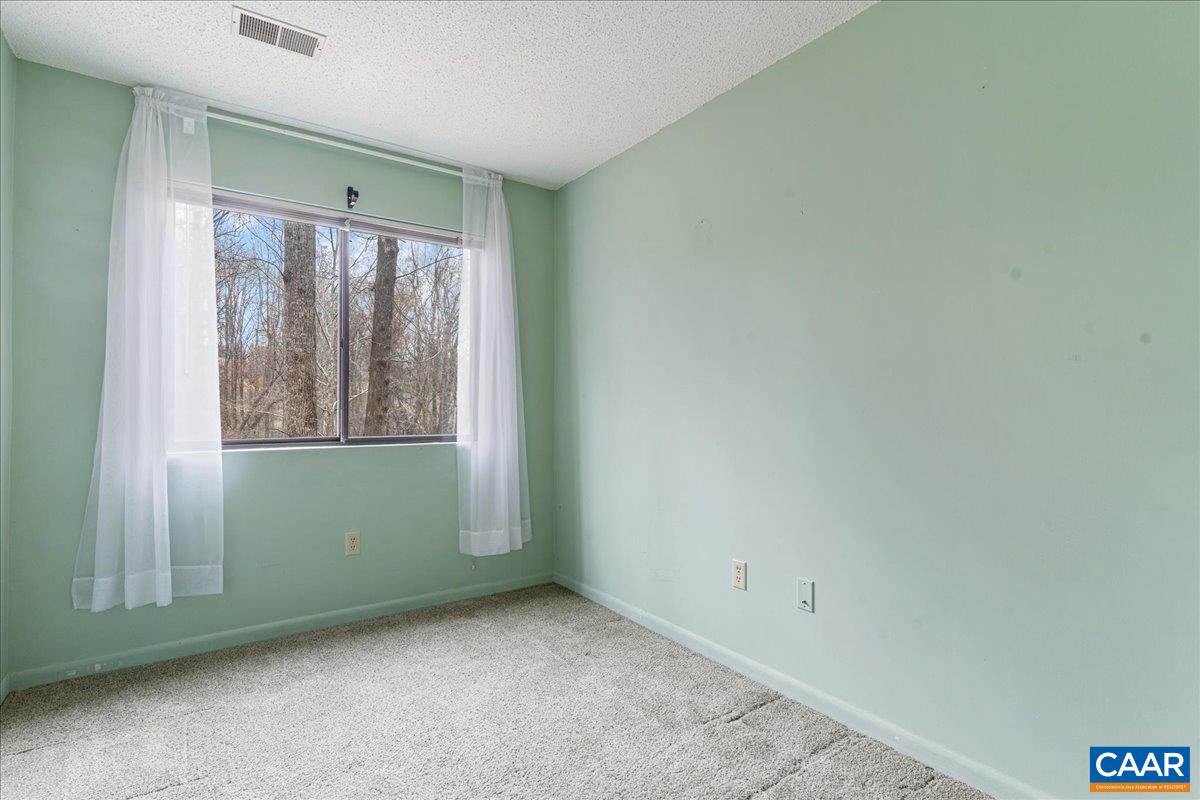 113 Turtle Creek Road, Unit 6 Charlottesville, VA 22901 - Photo 14 of 33 a view of an empty room with a window