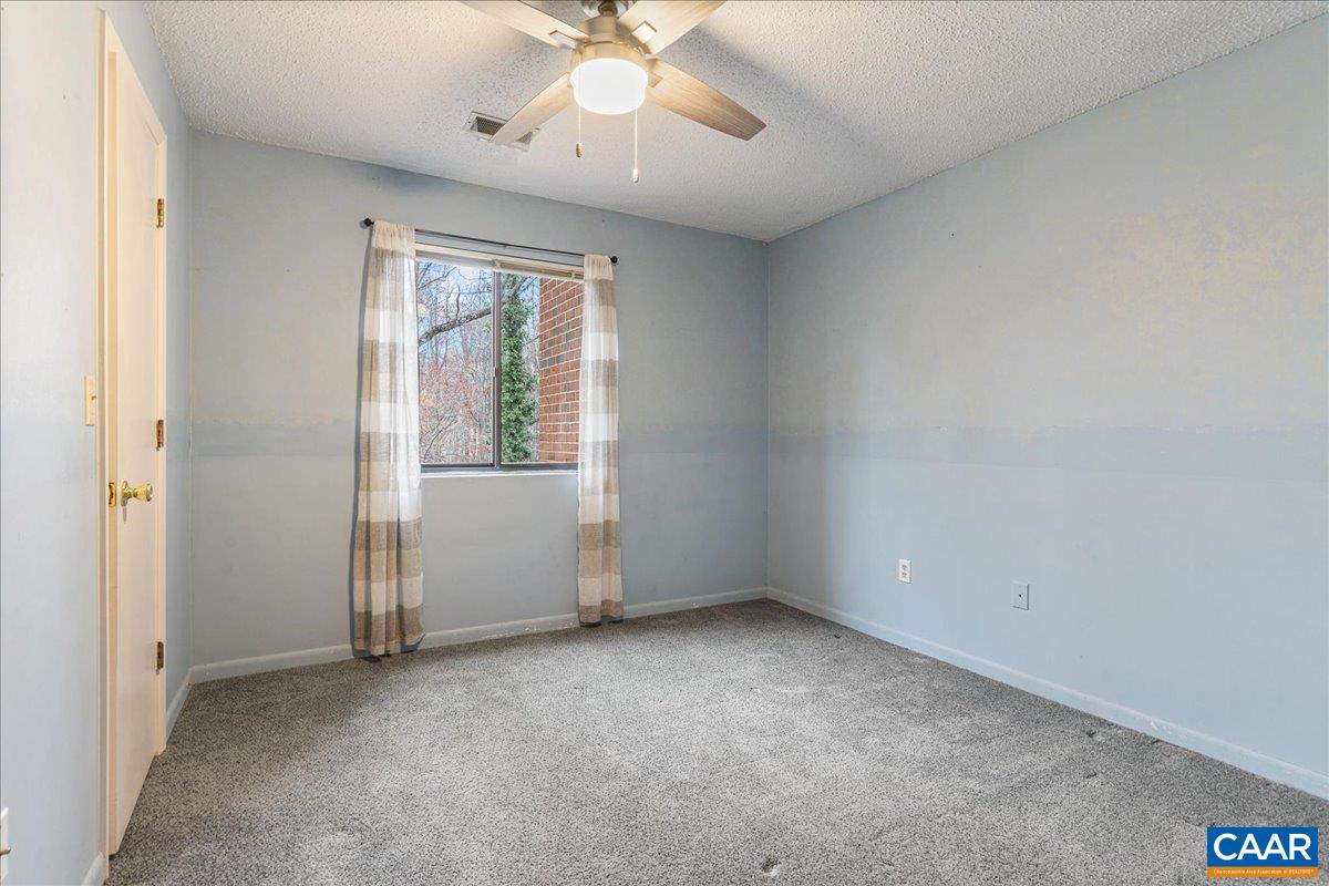 113 Turtle Creek Road, Unit 6 Charlottesville, VA 22901 - Photo 17 of 33 an empty room with windows and fan