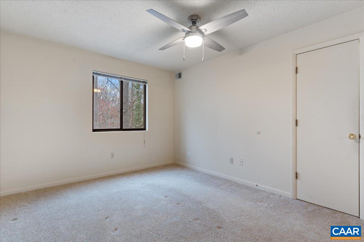 113 Turtle Creek Road, Unit 6 Charlottesville, VA 22901 - Photo 20 of 33 an empty room with a window and a fan