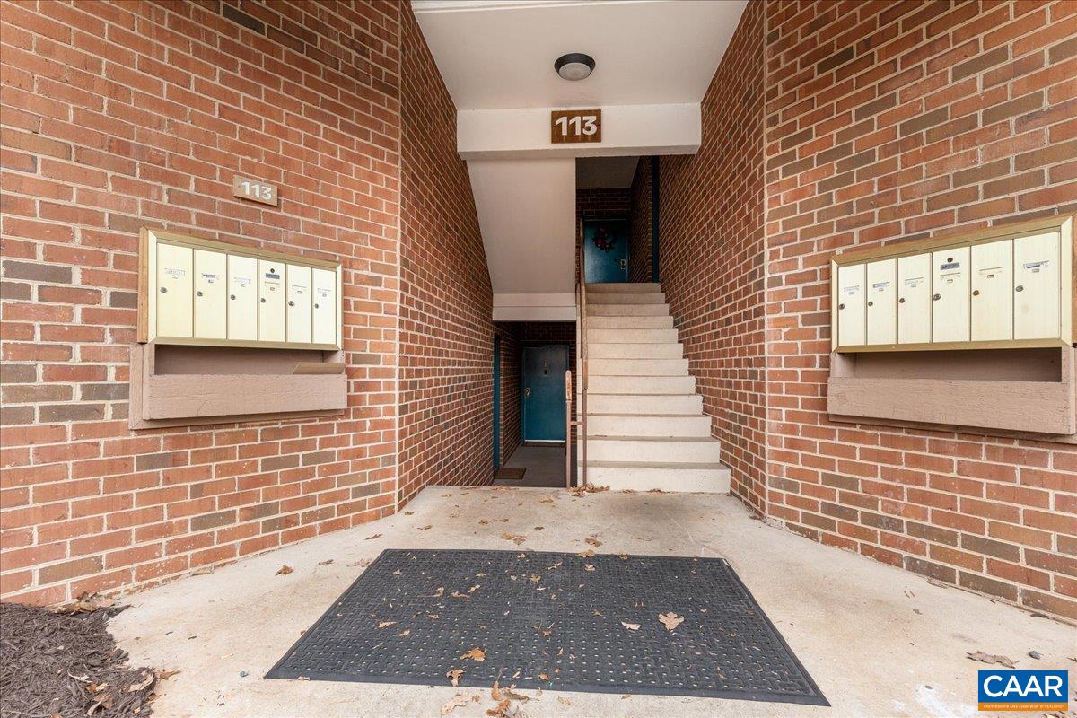 113 Turtle Creek Road, Unit 6 Charlottesville, VA 22901 - Photo 2 of 33 a view of a brick house with a door