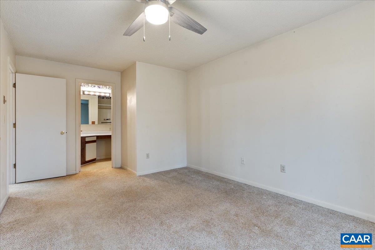 113 Turtle Creek Road, Unit 6 Charlottesville, VA 22901 - Photo 21 of 33 an empty room with chandelier fan
