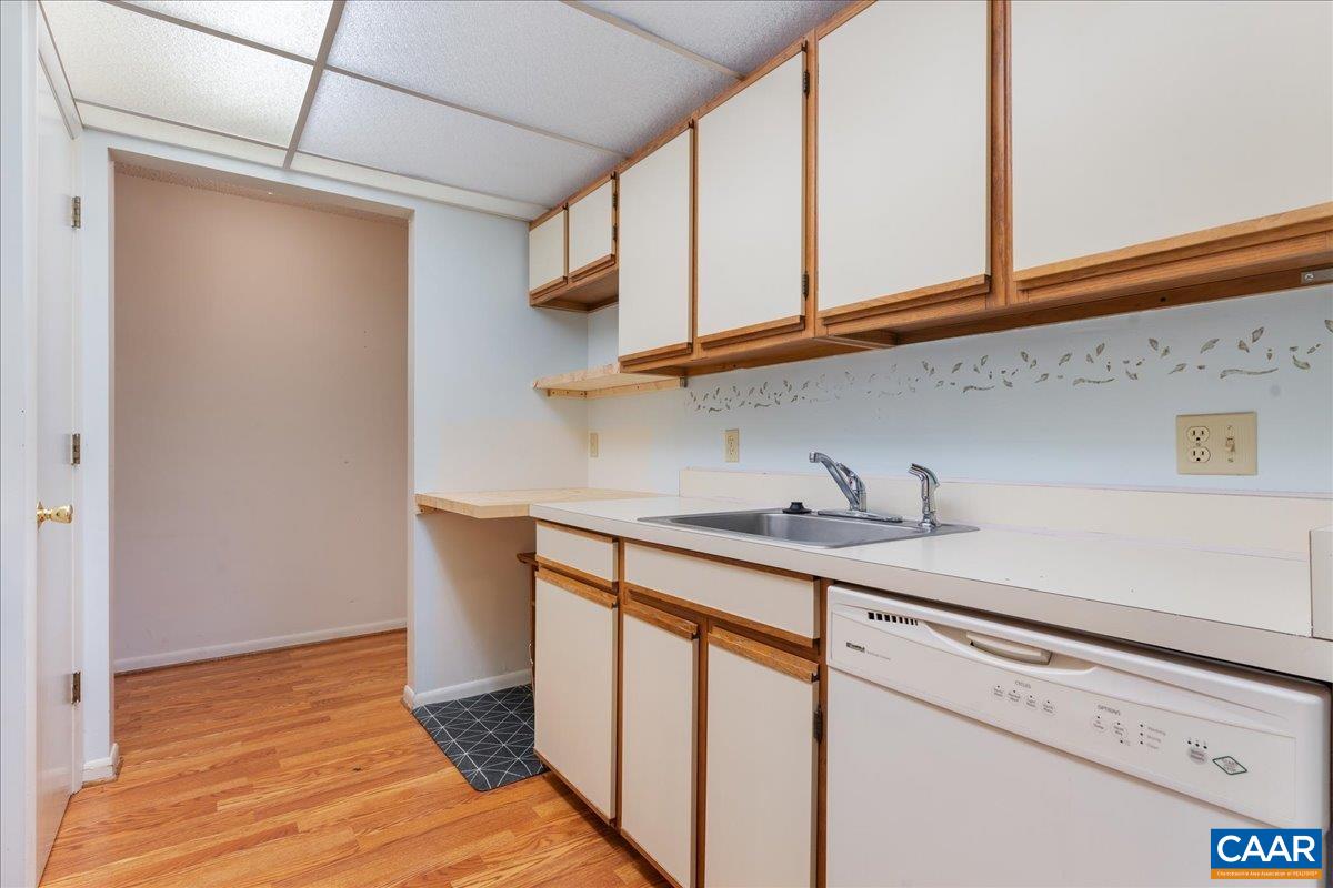 113 Turtle Creek Road, Unit 6 Charlottesville, VA 22901 - Photo 5 of 33 a kitchen with stainless steel appliances granite countertop a sink and cabinets