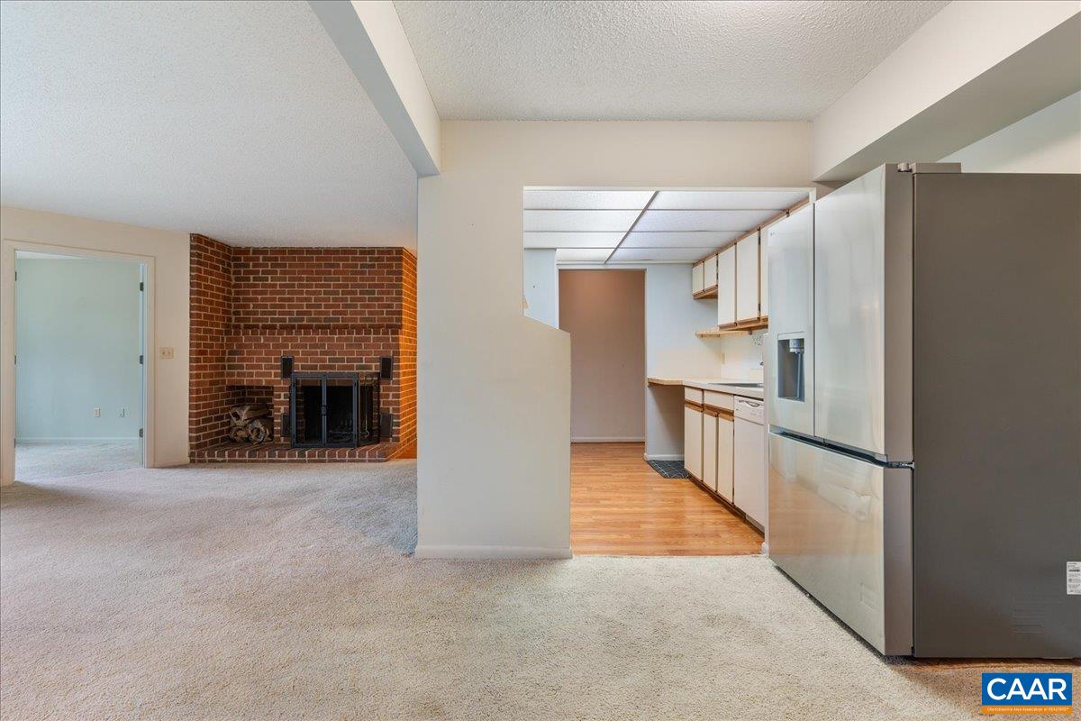 113 Turtle Creek Road, Unit 6 Charlottesville, VA 22901 - Photo 9 of 33 a view of a kitchen with a sink and a refrigerator