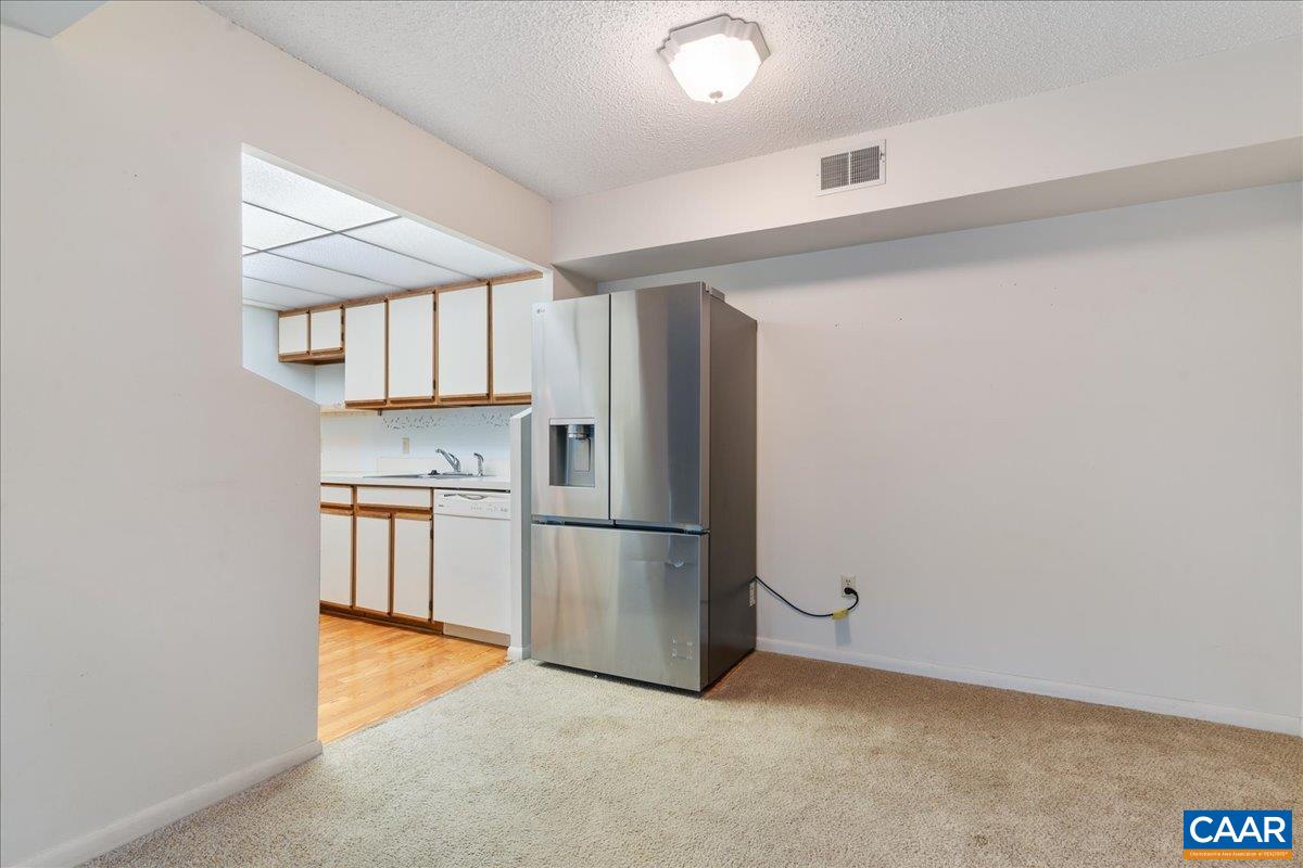 113 Turtle Creek Road, Unit 6 Charlottesville, VA 22901 - Photo 10 of 33 a kitchen with a refrigerator and a sink
