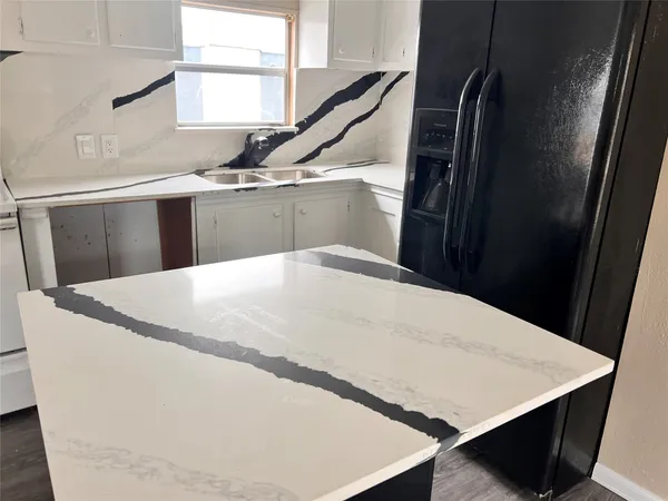 a large white tub sitting in a kitchen
