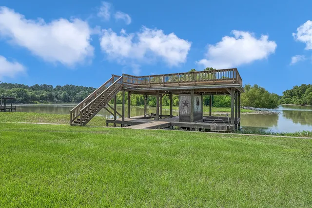 a view of a house with a yard and a patio
