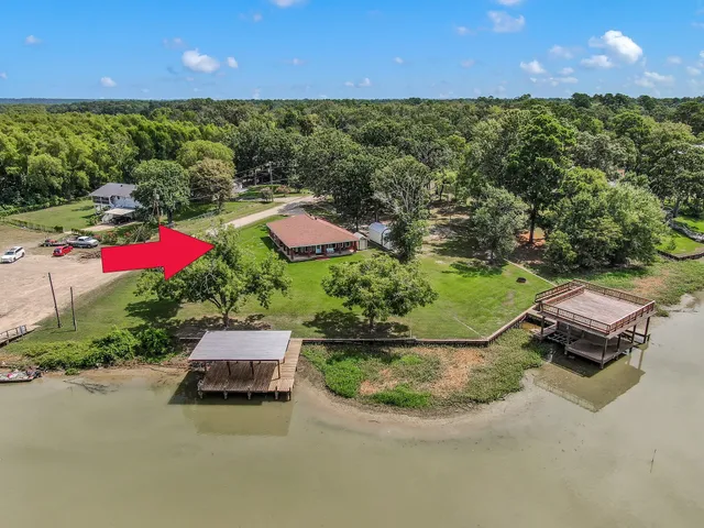 a view of a yard with table and chairs