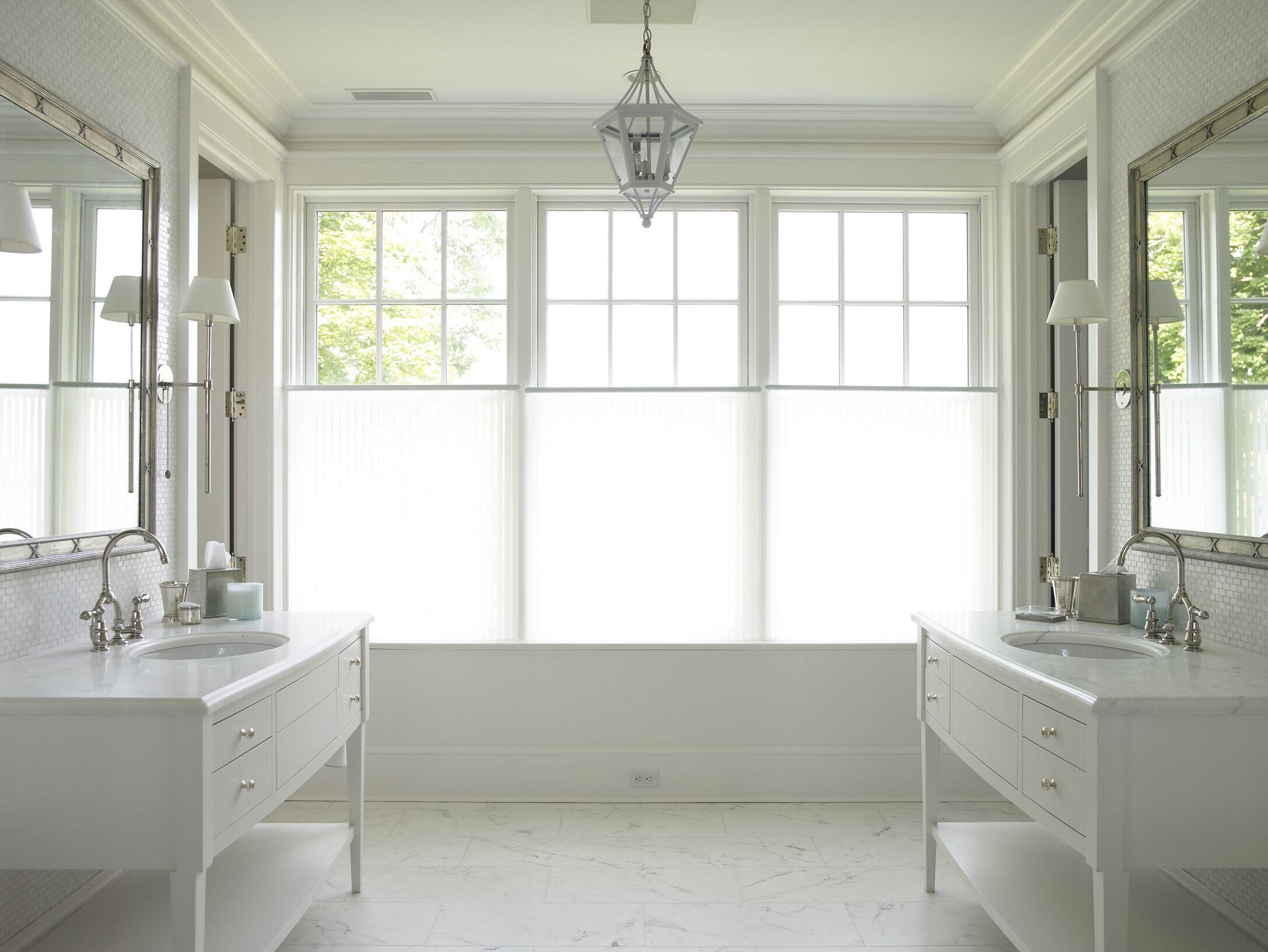 11 Harbor Bluff Lane Rowayton, CT 06853 - Photo 19 of 31 a bathroom with a double vanity sink window and mirror