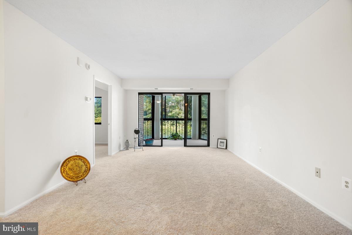 15107 Interlachen Drive, Unit 2321 Silver Spring, MD 20906 - Photo 11 of 35 an empty room with window