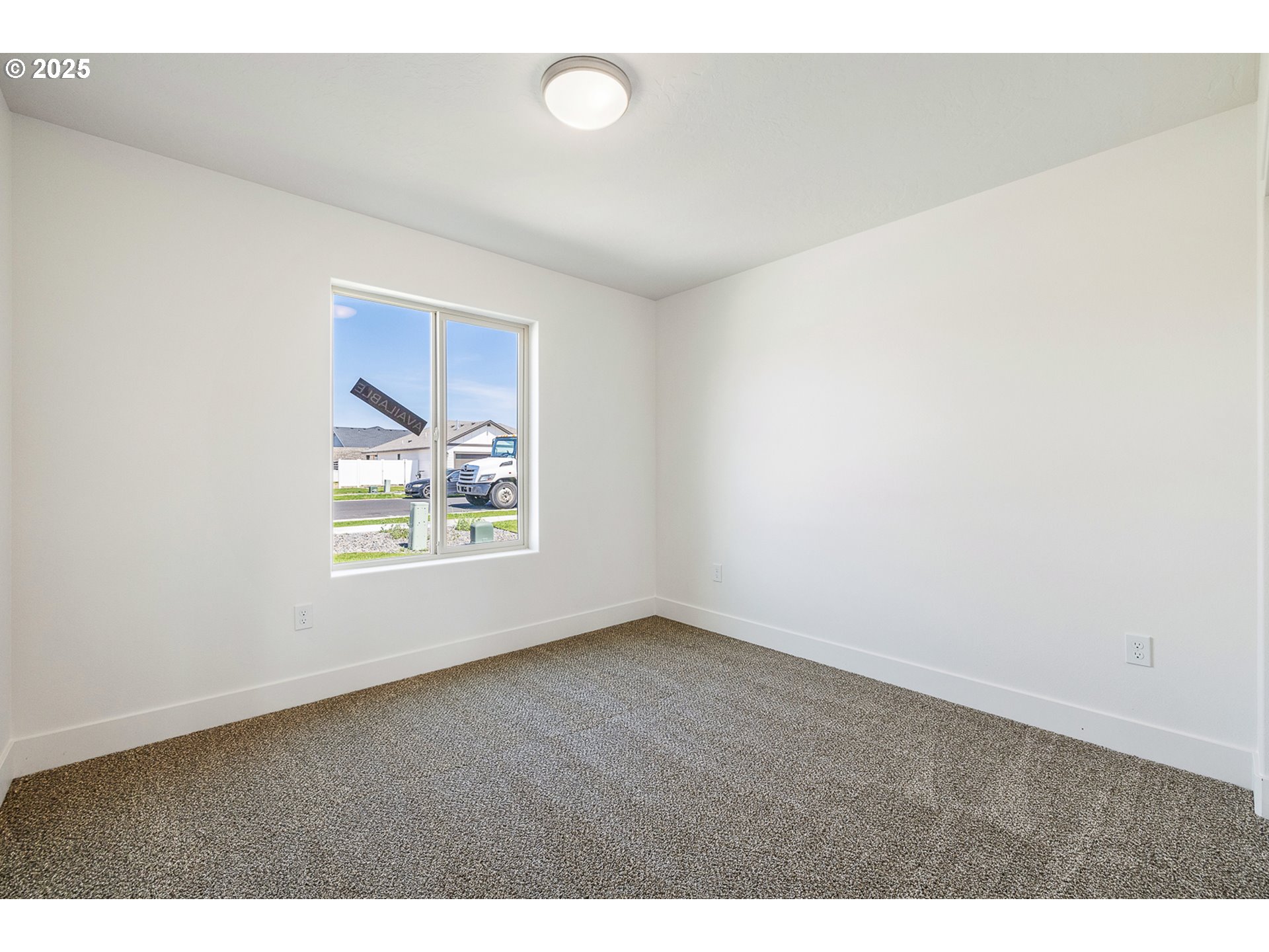 303 Sage Street Boardman, OR 97818 - Photo 17 of 25 a view of an empty room with a window