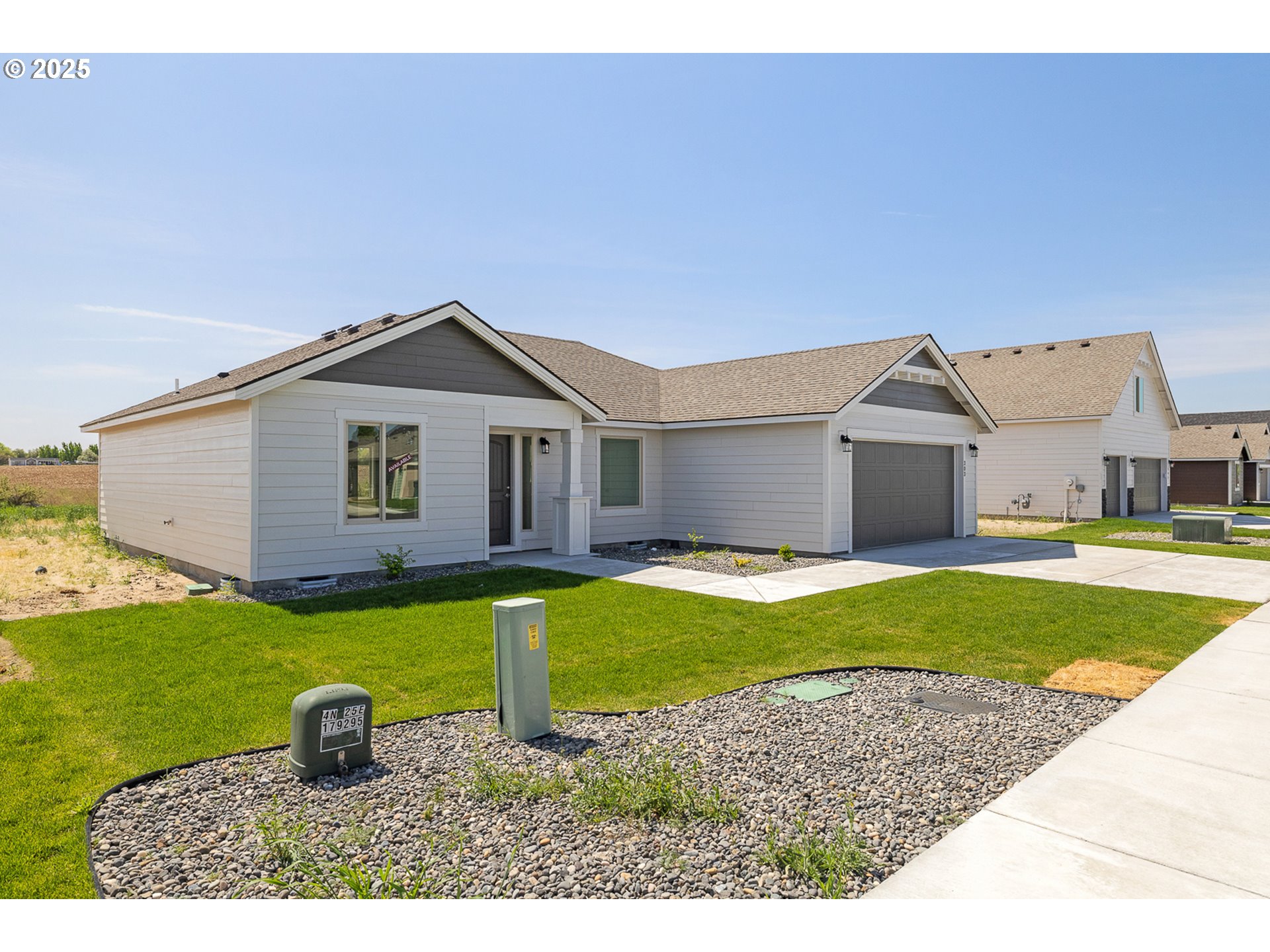 303 Sage Street Boardman, OR 97818 - Photo 21 of 25 a front view of a house with a yard
