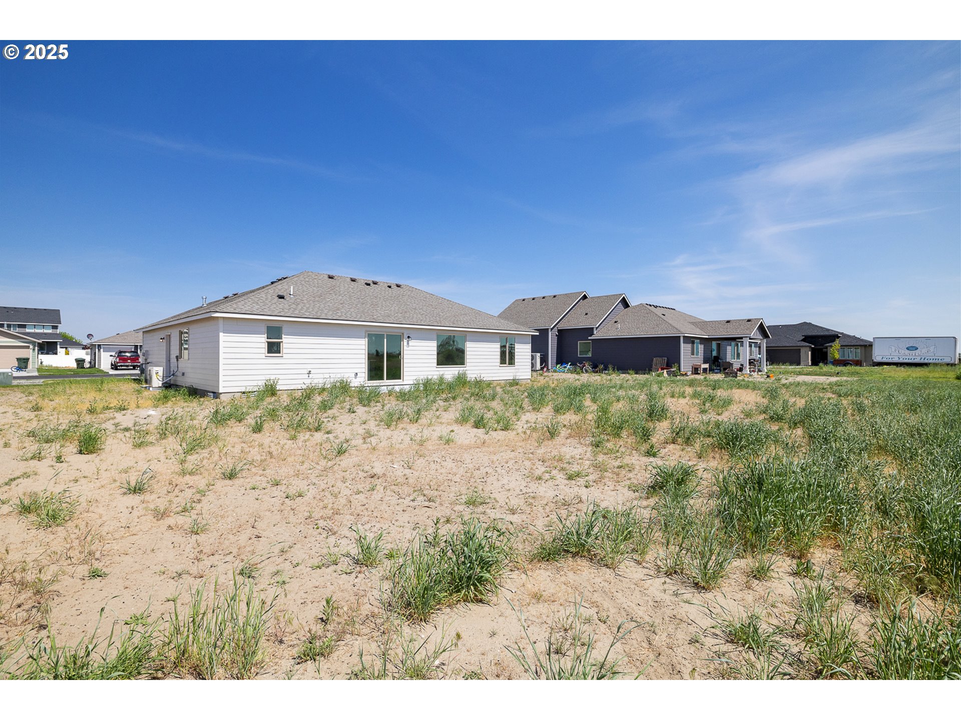 303 Sage Street Boardman, OR 97818 - Photo 24 of 25 a front view of a house with a yard
