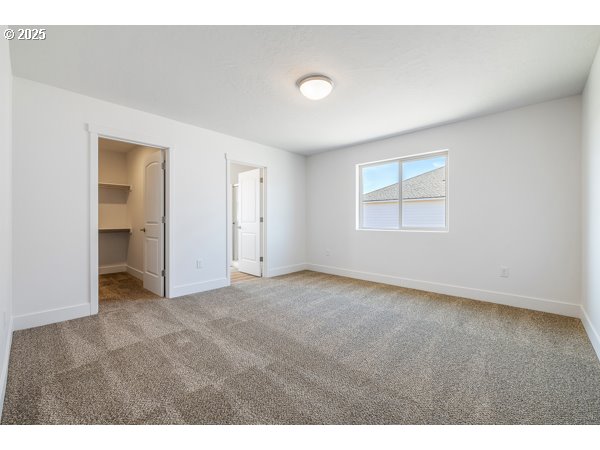 303 Sage Street Boardman, OR 97818 - Photo 3 of 25 a view of an empty room with a window