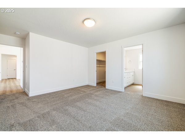 303 Sage Street Boardman, OR 97818 - Photo 4 of 25 a view of an empty room with wooden floor