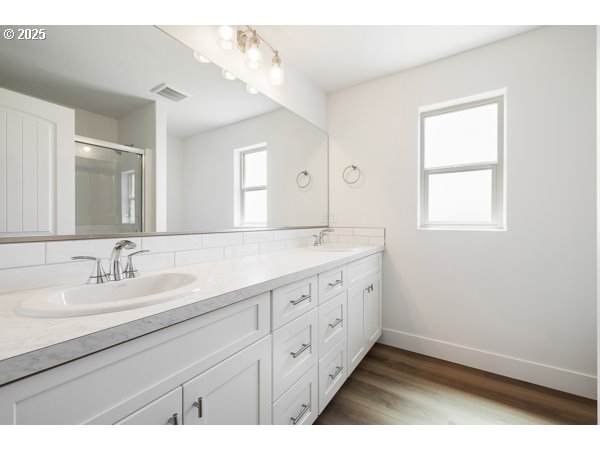 303 Sage Street Boardman, OR 97818 - Photo 6 of 25 a spacious bathroom with double sink large mirror and