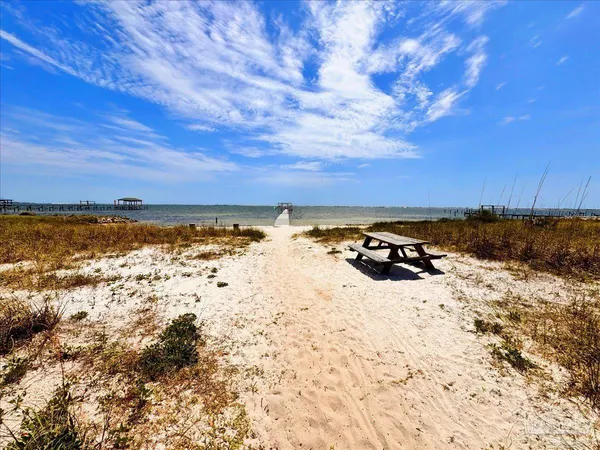 a view of a swimming pool with a yard in back