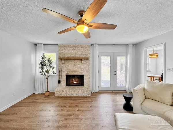 a living room with furniture and a fireplace