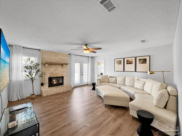 a living room with furniture and a fireplace
