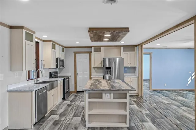 a view of kitchen and empty room
