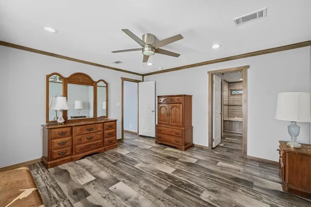 a bedroom with furniture and a window