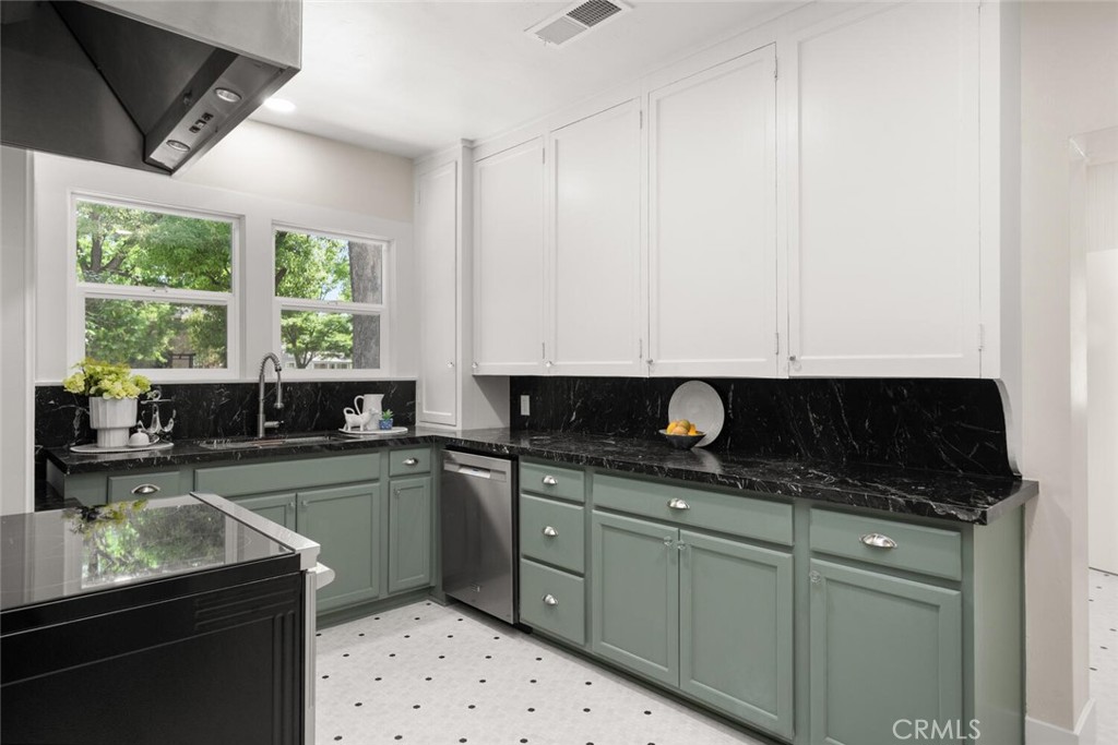 1336 Chestnut Street Chico, CA 95928 - Photo 15 of 41 a kitchen with stainless steel appliances granite countertop a sink and a stove
