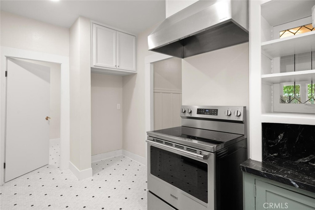 1336 Chestnut Street Chico, CA 95928 - Photo 16 of 41 a kitchen with granite countertop a stove and a refrigerator