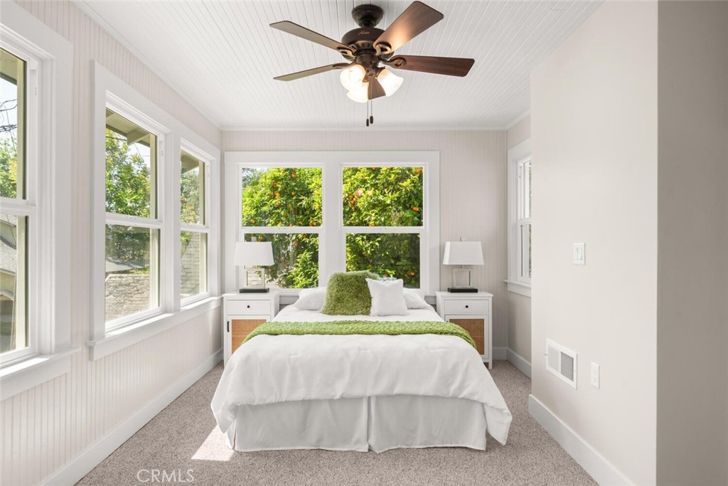 1336 Chestnut Street Chico, CA 95928 - Photo 31 of 41 a bedroom with a large bed and a chandelier