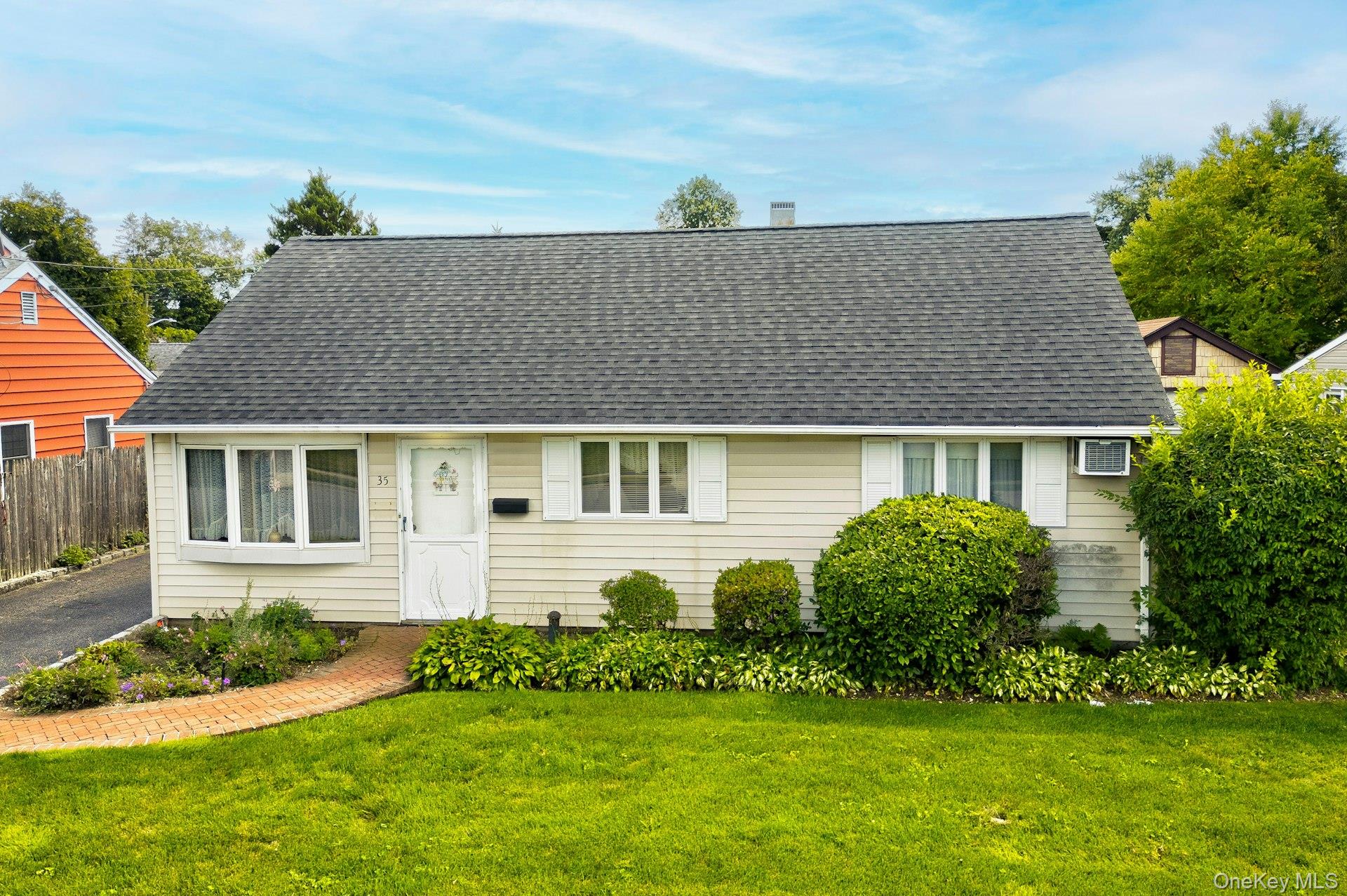 Cape cod house with roof with shingles