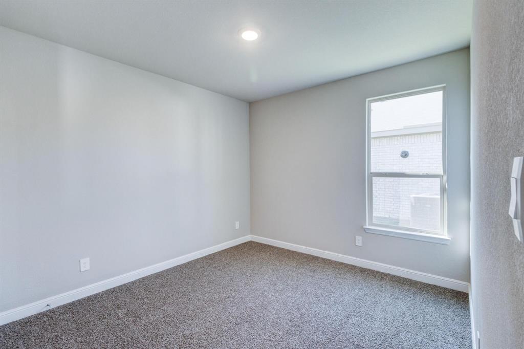 15524 Balham Pass Fort Worth, TX 76247 - Photo 3 of 10 an empty room with a window