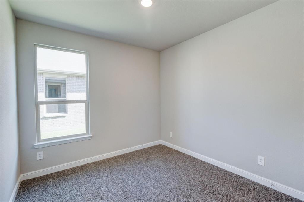 15524 Balham Pass Fort Worth, TX 76247 - Photo 4 of 10 an empty room with a window
