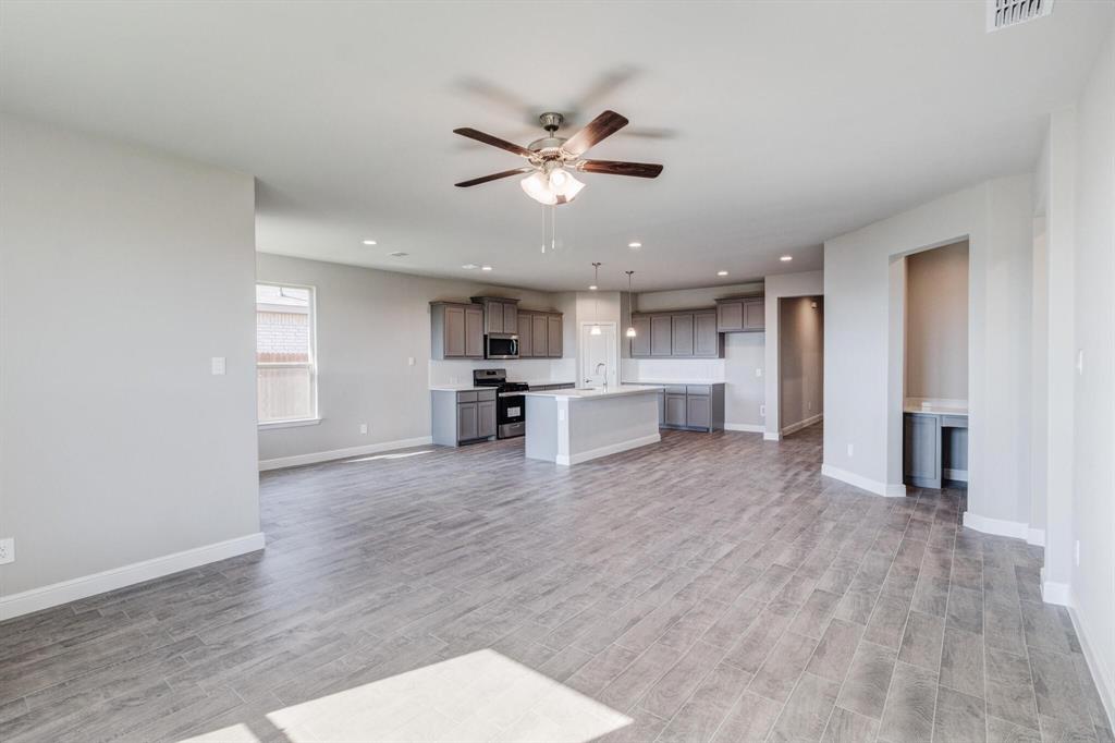 15524 Balham Pass Fort Worth, TX 76247 - Photo 9 of 10 a view of a kitchen with a sink and a stove top oven
