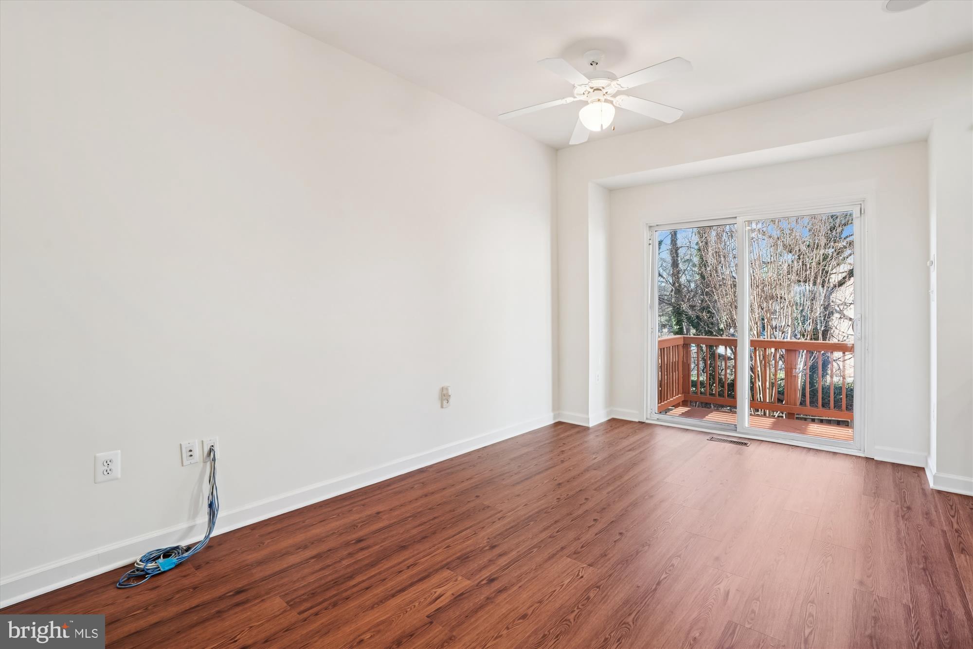 796 Col Edmonds Court Warrenton, VA 20186 - Photo 11 of 47 an empty room with wooden floor and windows