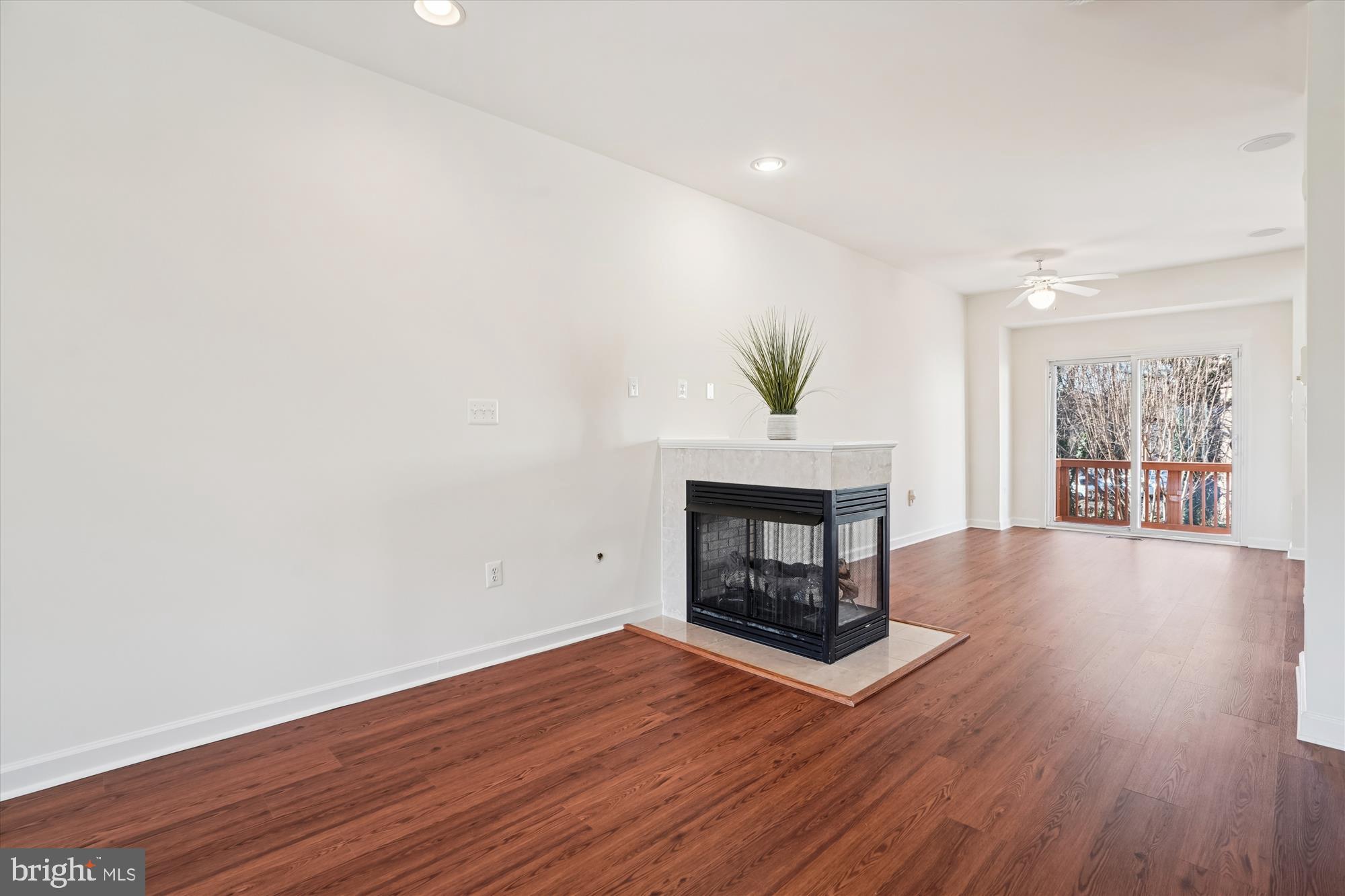 796 Col Edmonds Court Warrenton, VA 20186 - Photo 15 of 47 a living room with wooden floor and a fireplace