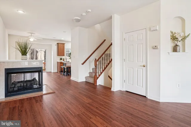 a view of an entryway with wooden floor