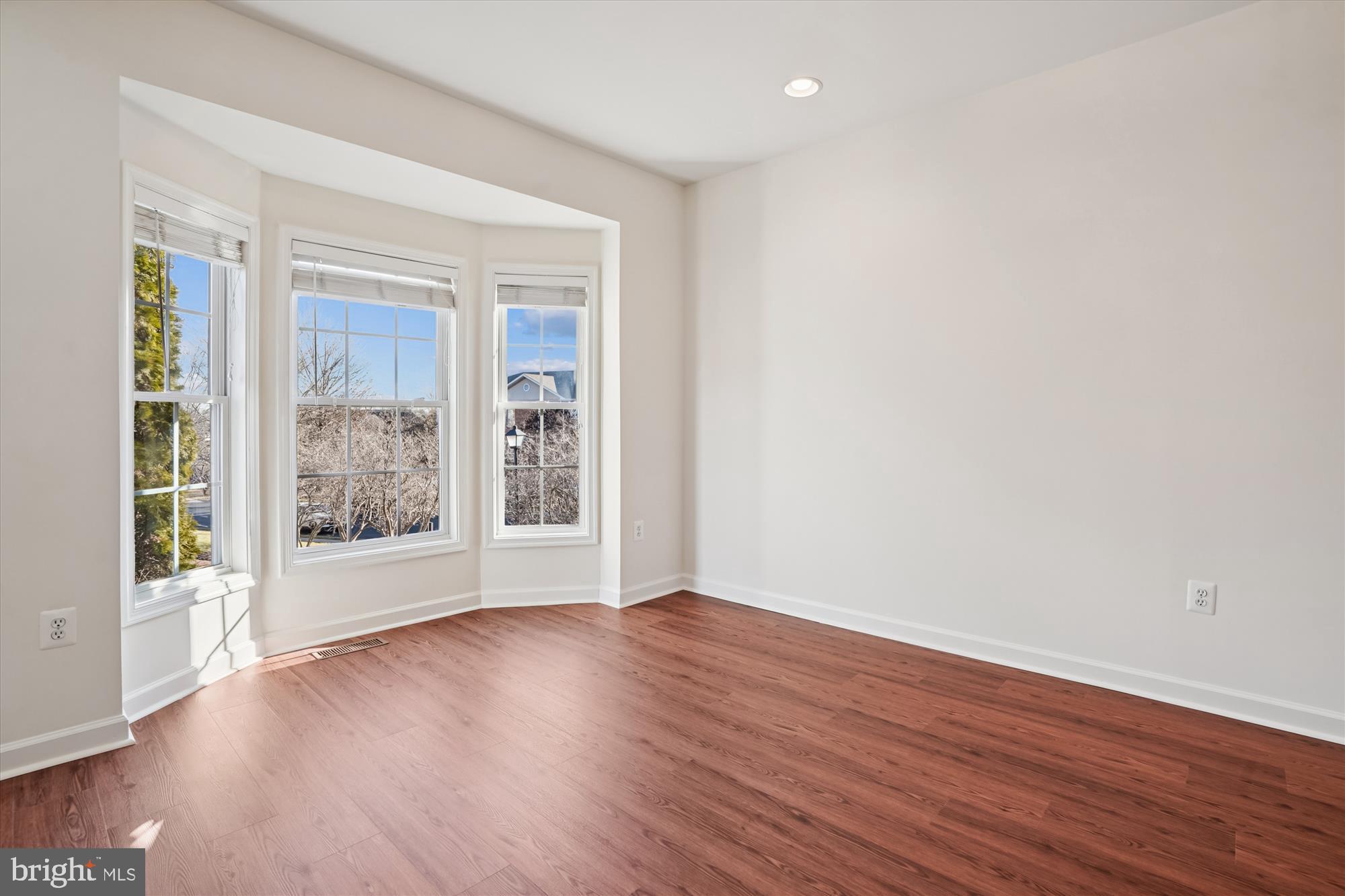 796 Col Edmonds Court Warrenton, VA 20186 - Photo 19 of 47 a view of an empty room with wooden floor and a window