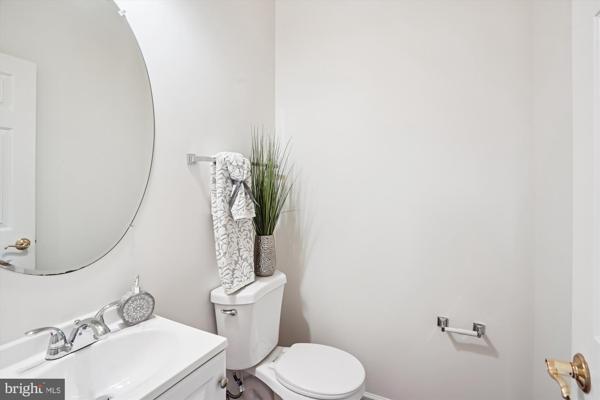 796 Col Edmonds Court Warrenton, VA 20186 - Photo 20 of 47 a white toilet sitting next to a bathroom sink