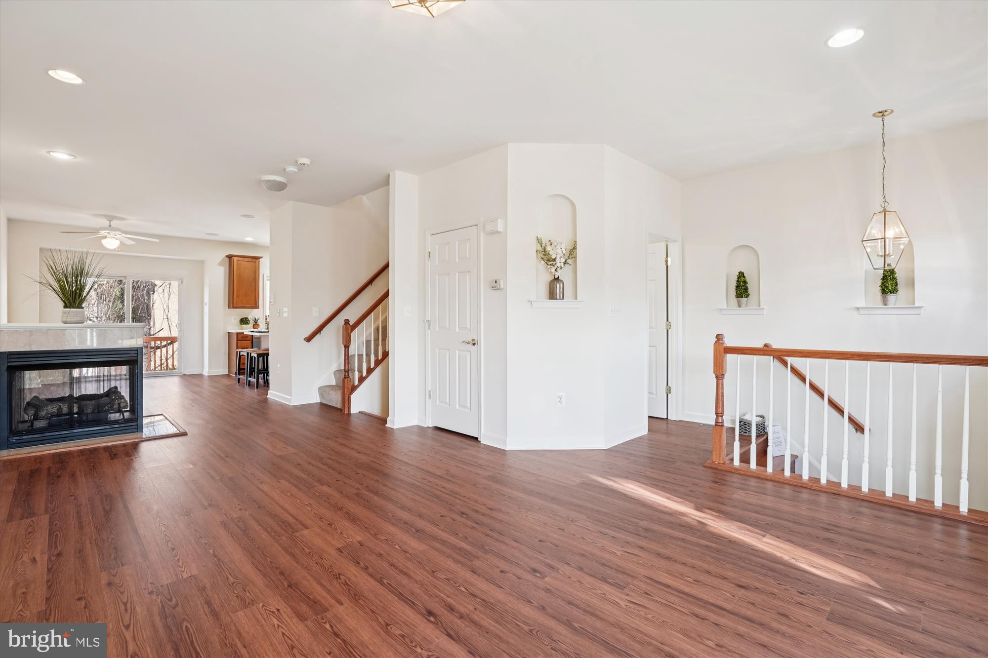 796 Col Edmonds Court Warrenton, VA 20186 - Photo 21 of 47 a view of main area with wooden floor and stairs