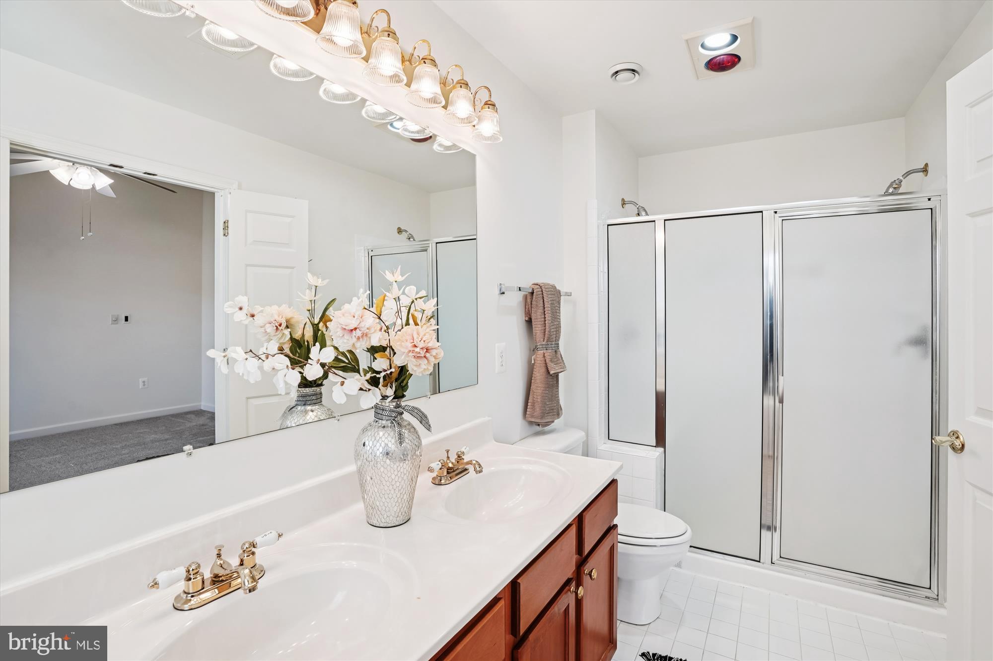 796 Col Edmonds Court Warrenton, VA 20186 - Photo 32 of 47 a bathroom with a double vanity sink and a mirror