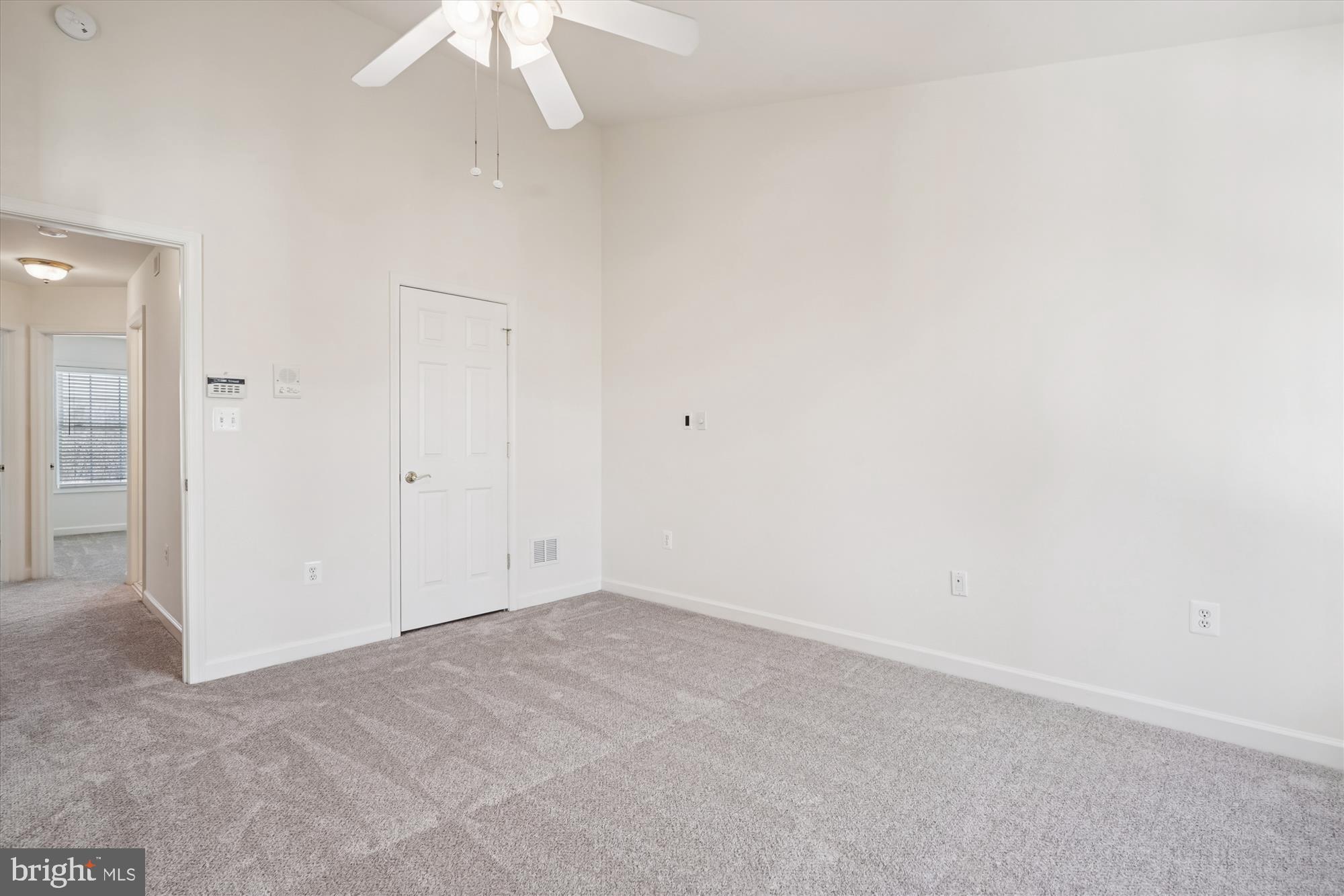 796 Col Edmonds Court Warrenton, VA 20186 - Photo 36 of 47 an empty room with a chandelier fan and closet