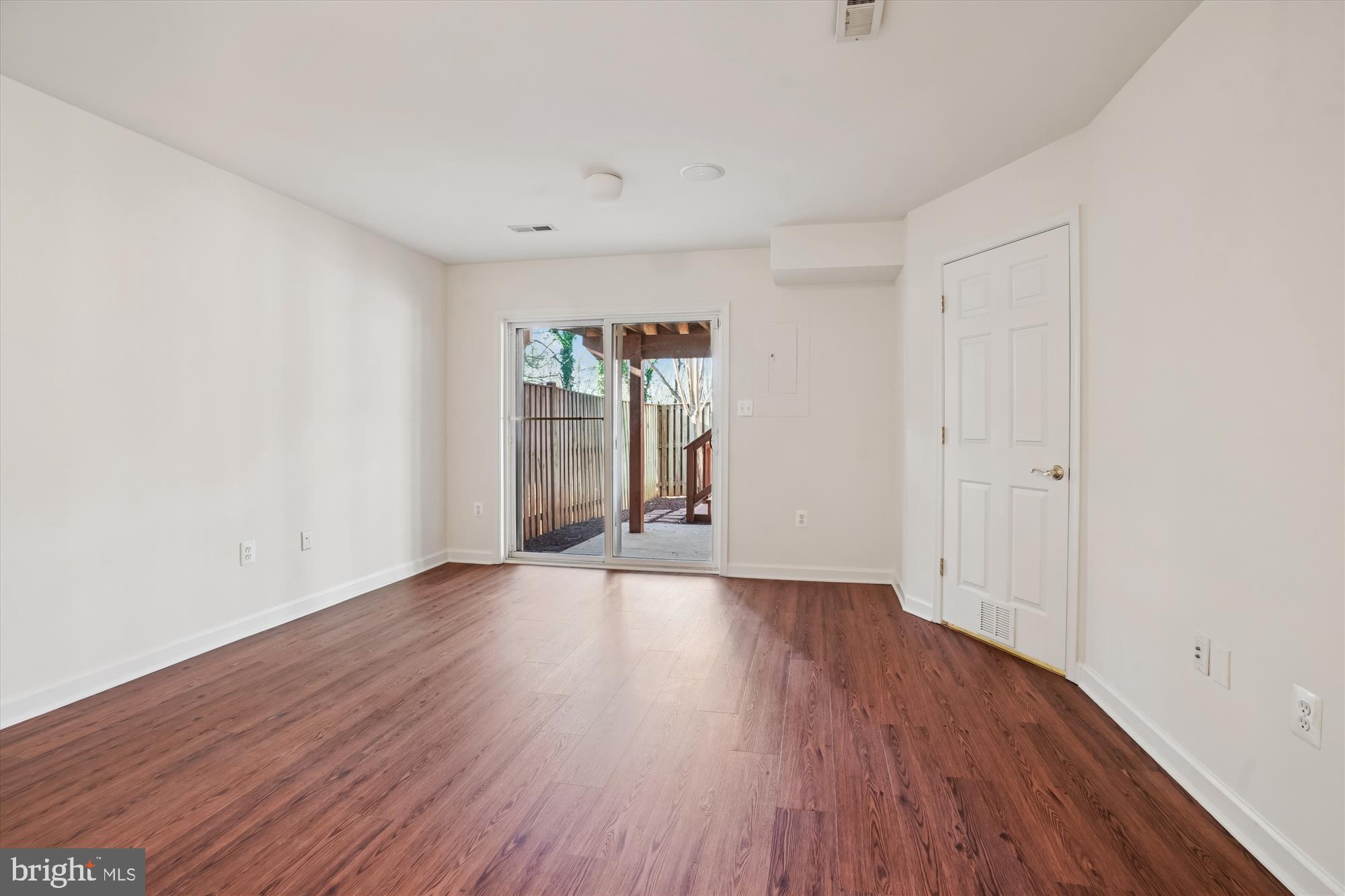 796 Col Edmonds Court Warrenton, VA 20186 - Photo 42 of 47 a view of an empty room with wooden floor and a window