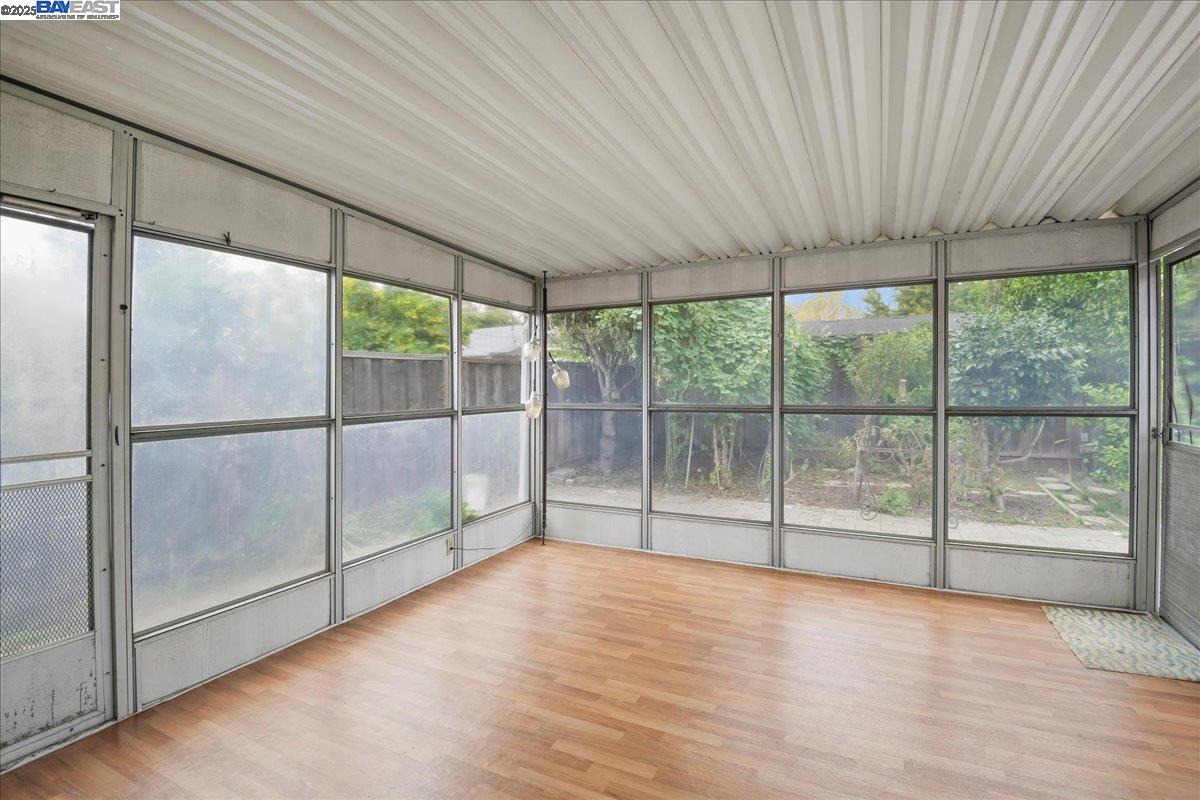 1043 Bonner Avenue Fremont, CA 94536 - Photo 13 of 16 a view of empty room with wooden floor and fan