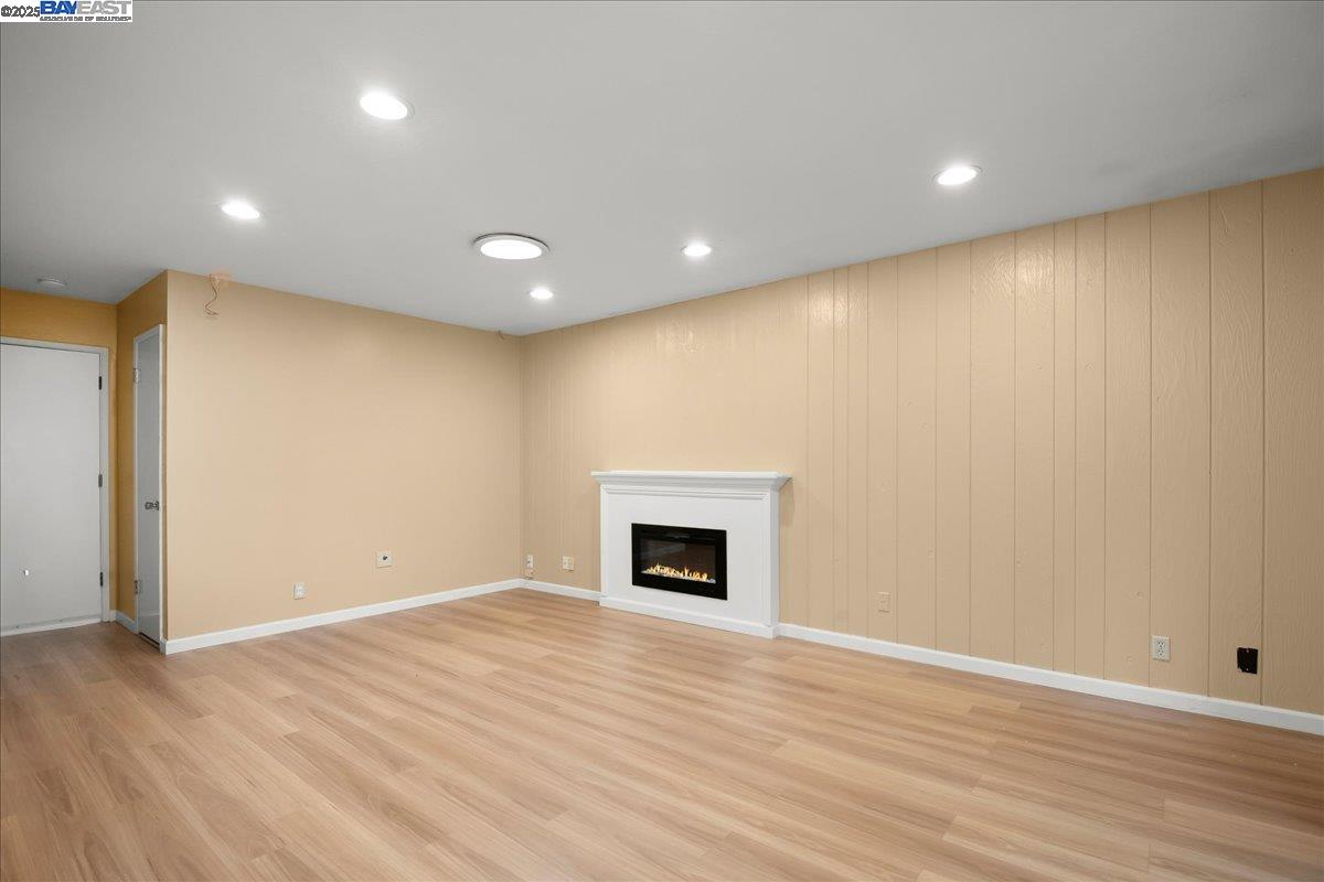 1043 Bonner Avenue Fremont, CA 94536 - Photo 6 of 16 a view of empty room with wooden floor and fireplace